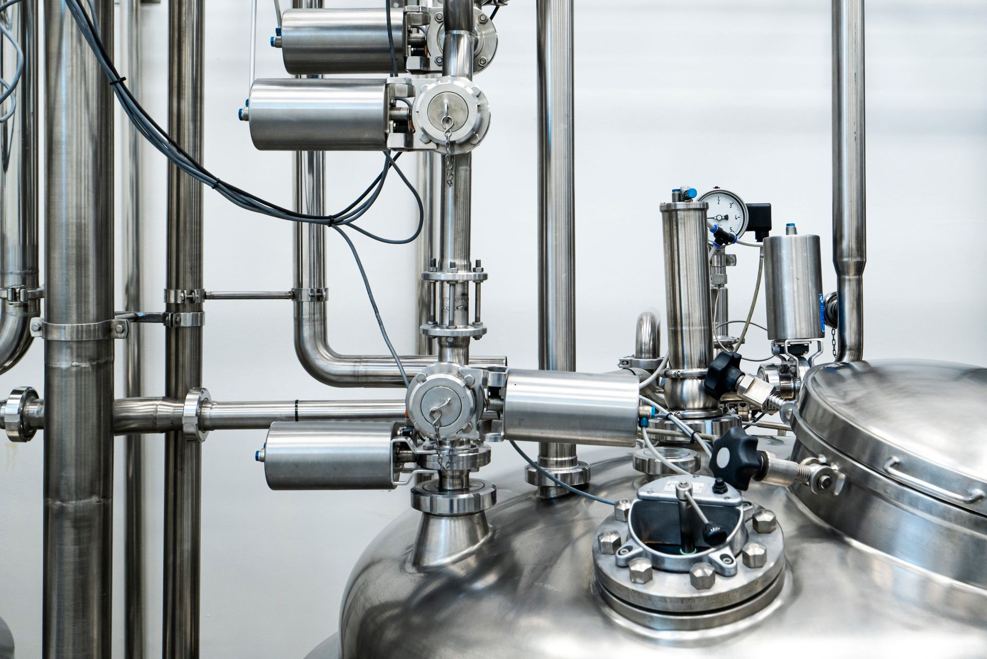 Stainless steel process equipment inside an industrial plant