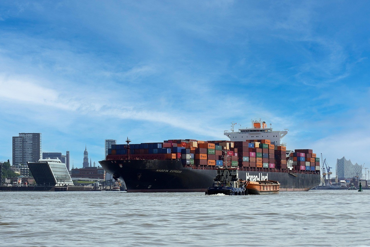 a large boat with a lot of colorful containers on it