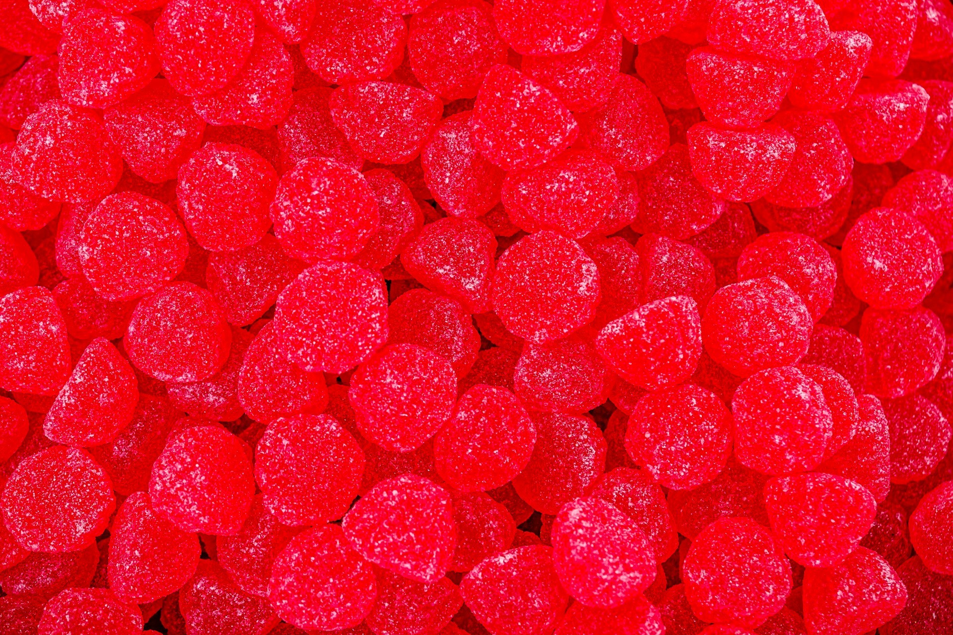 Close-up of bright red jelly candies, illustrating products affected by the FDA's recent ban on Red No. 3, a synthetic dye commonly used in foods, drinks, and medications.