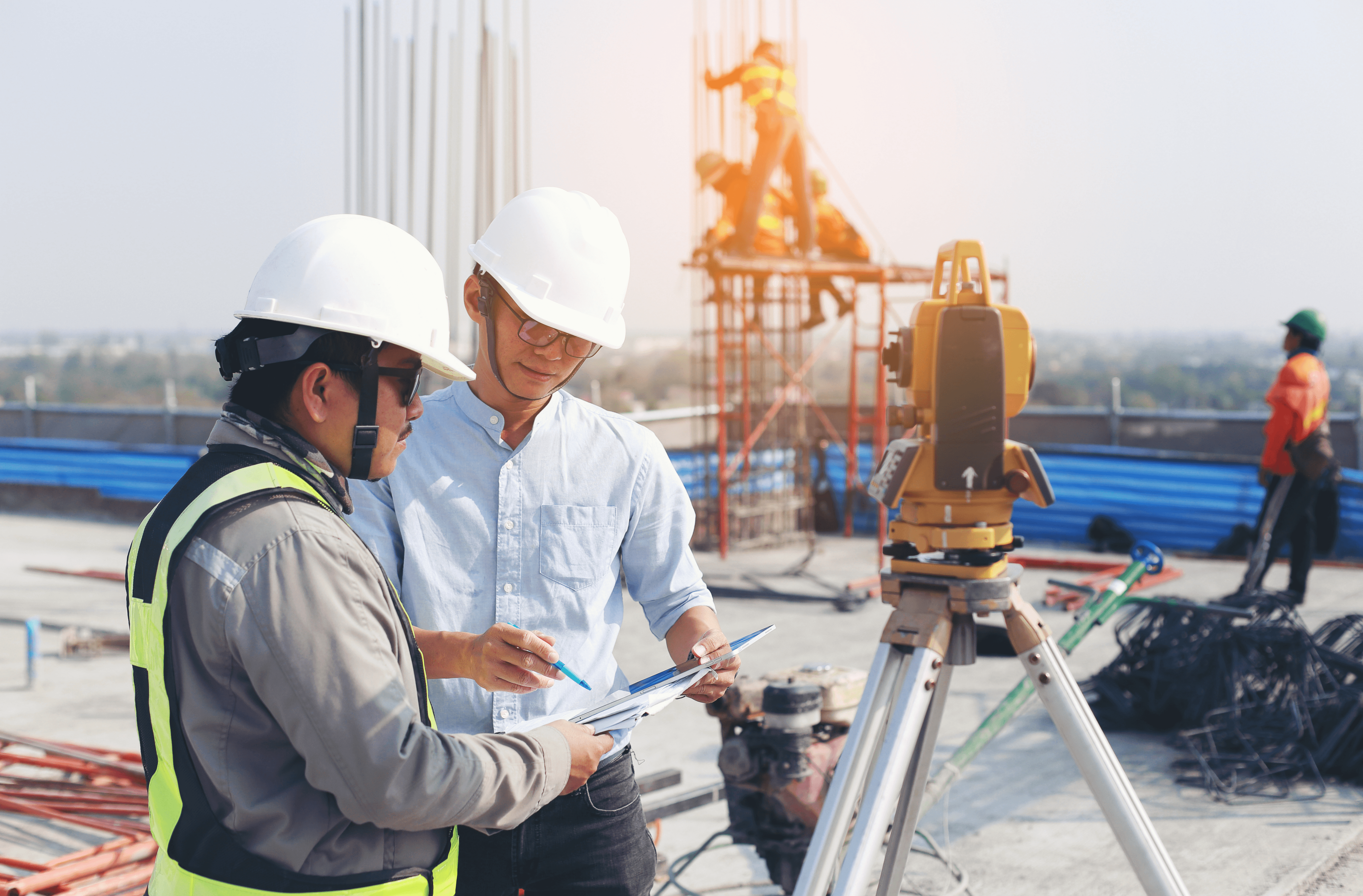 Two men in the foreground of construction site