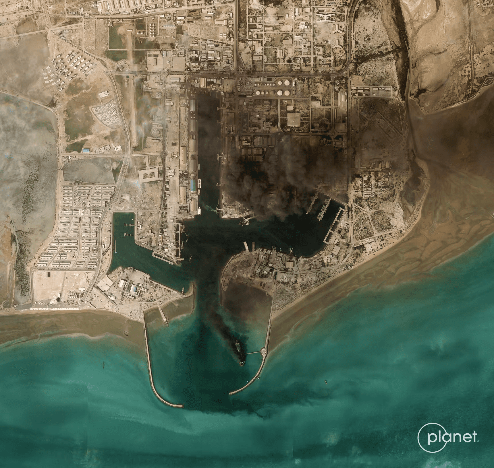 Smoke billows Monday after an explosion from the port of Bandar Abbas in Iran, along the strait of Hormu
